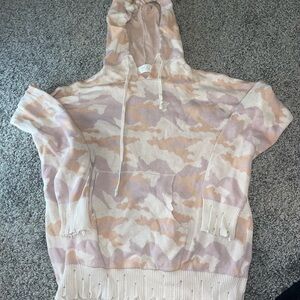 Tan and cream sweater with a camo pattern #camouflage #MODontrend